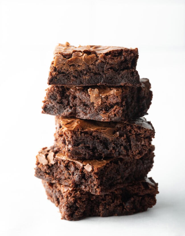 Stack of 5 box brownies on a white background.