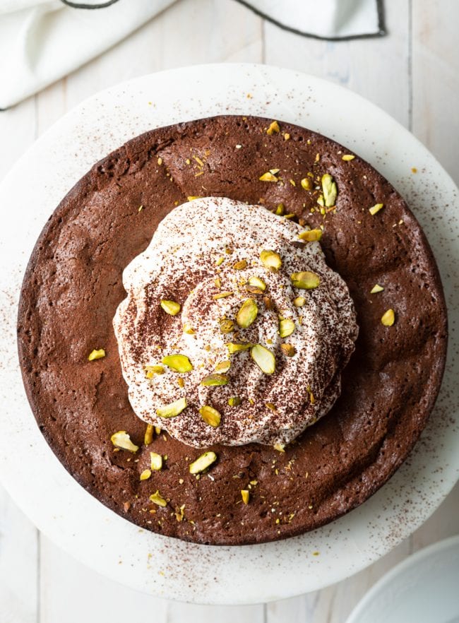 gluten free brownie cake overhead shot of whole cake on stand