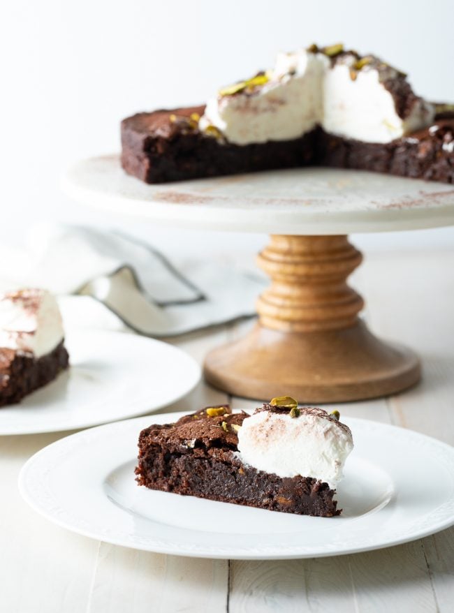 flourless chocolate brownie cake -sliced on plate 