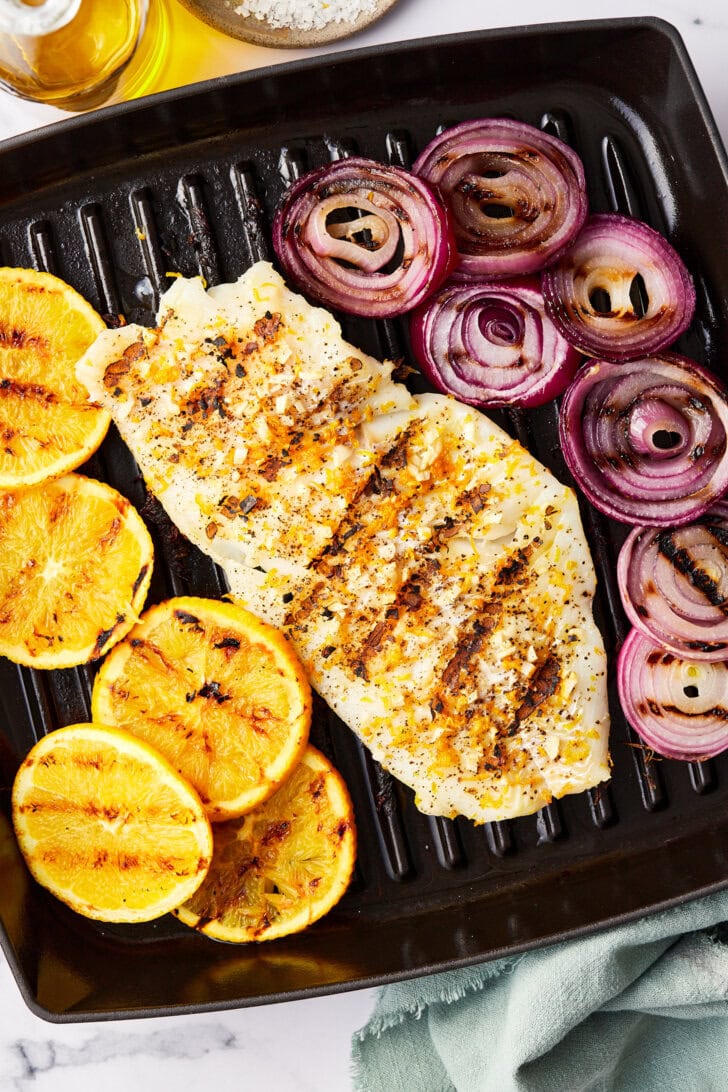 grouper on the grill with onions and oranges