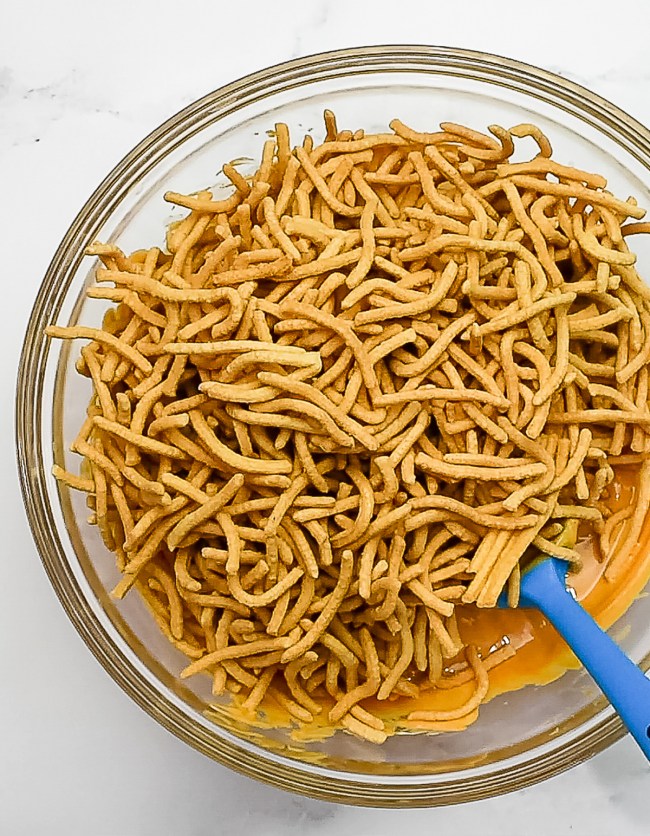 add chow mein noodles to melted mixture