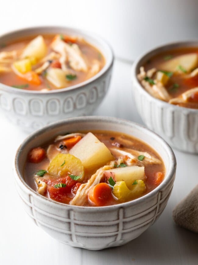 Small bowls of healthy slow cooker chicken stew.