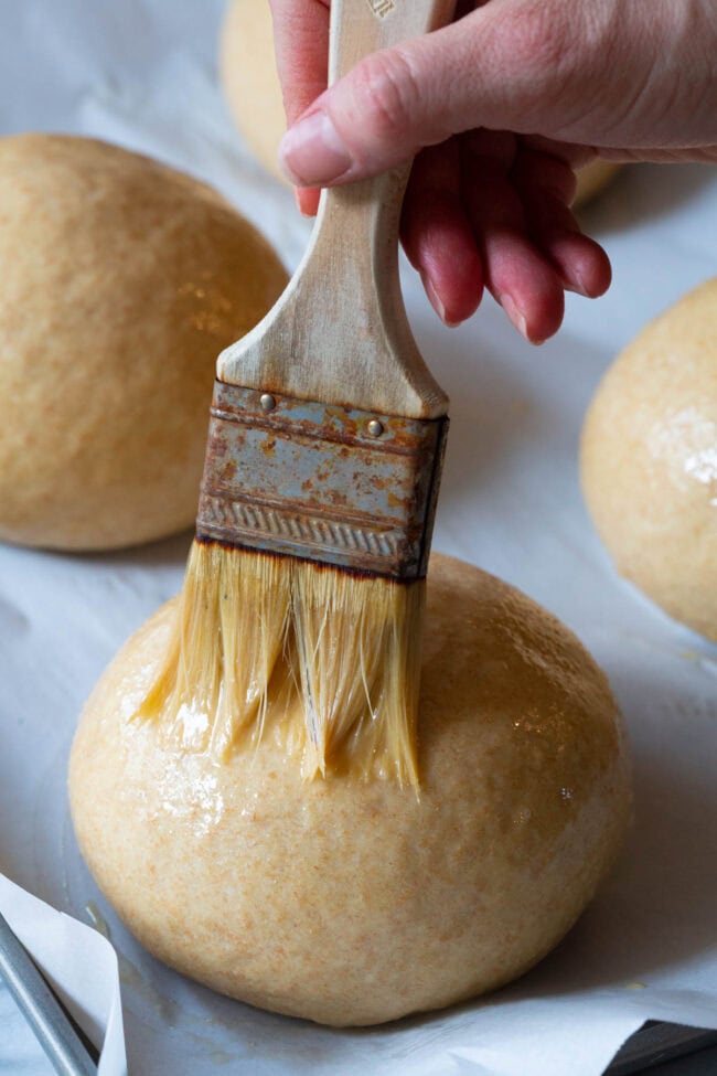 brush the dough balls with the egg wash