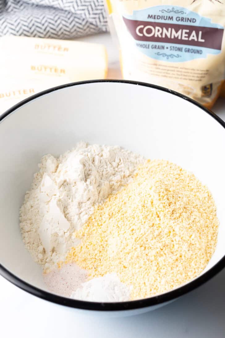 White mixing bowl with dry ingredients.