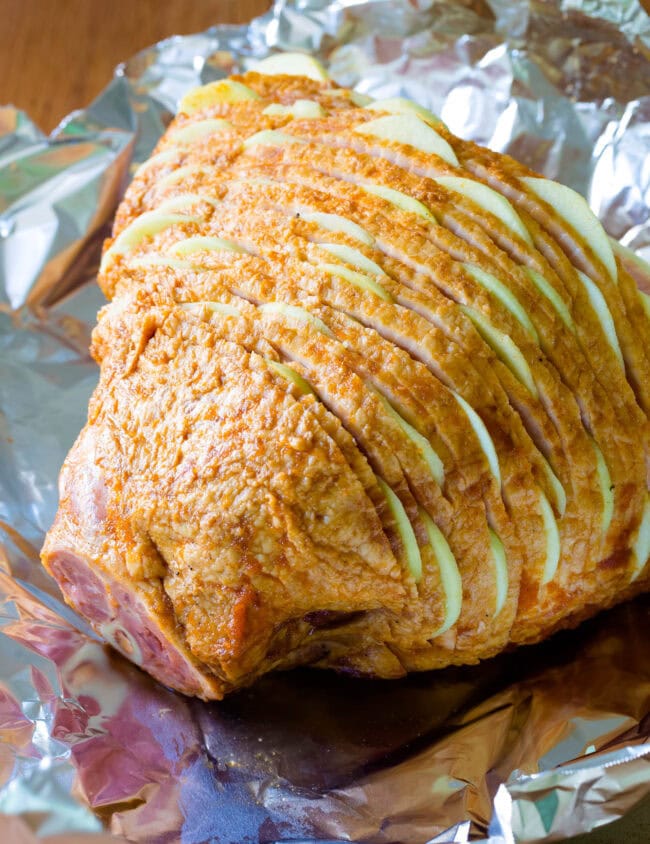 Ham with apples tucked in between the layers before getting baked. 