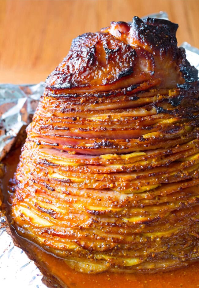 Fully Cooked Apple Stuffed Ham with Mustard Glaze on the baking sheet. 