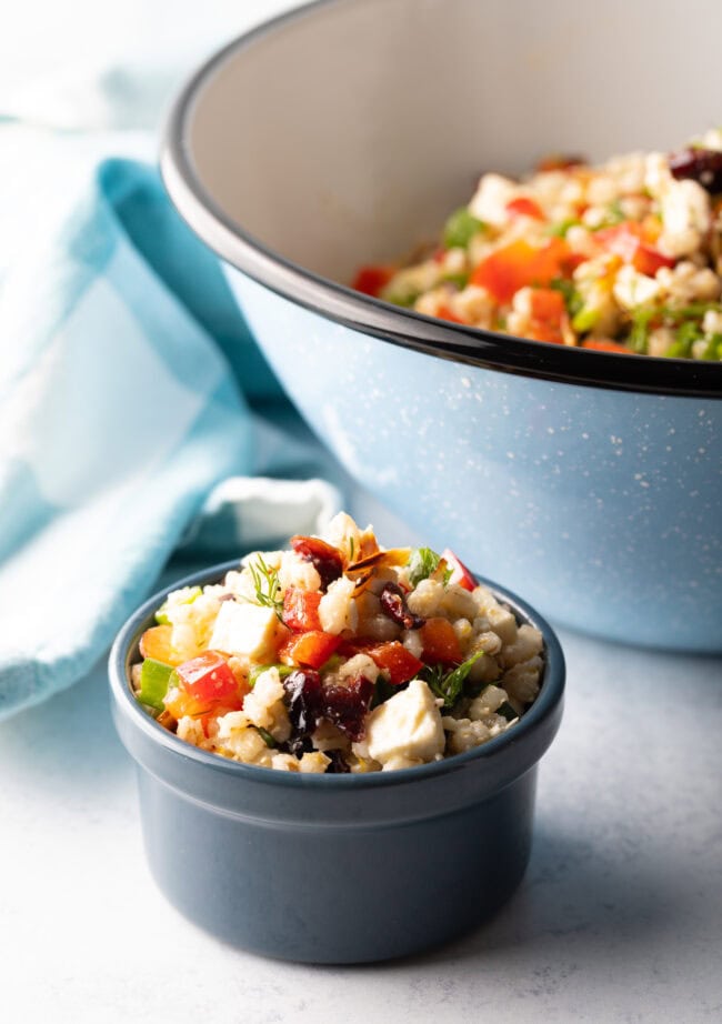 Pearl barley and veggie salad in a small gray ramekin.