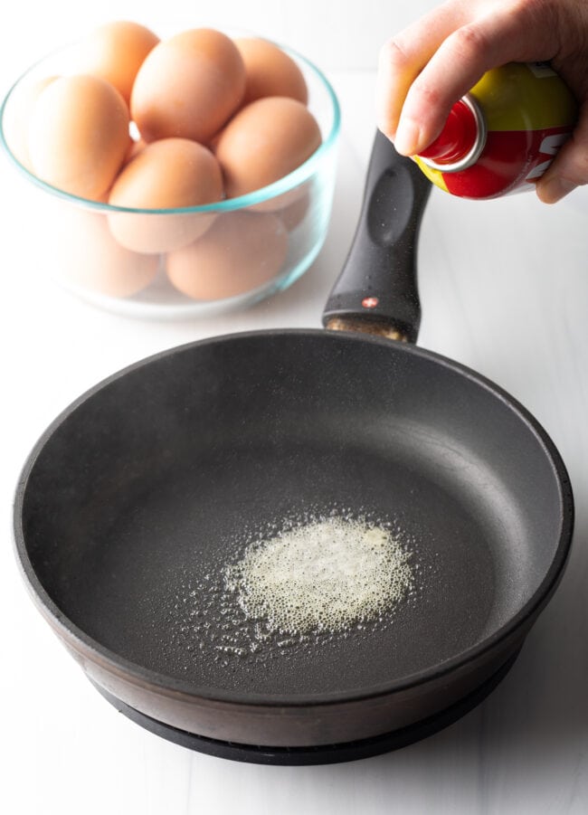 Butter melted in a large black skillet.