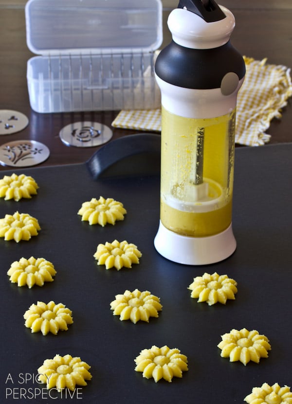 Lemon Pressed Cookies Recipe with Lemon Cream Filling | ASpicyPerspective.com #cookies #lemon #cookies #kidfriendly