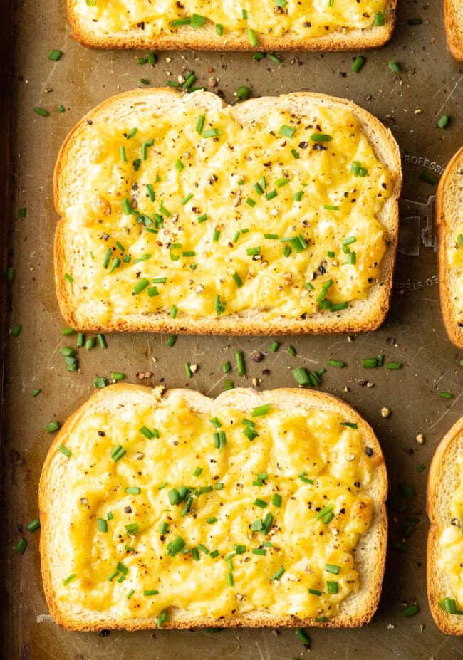 Top down view cheese on toast with fresh chives.