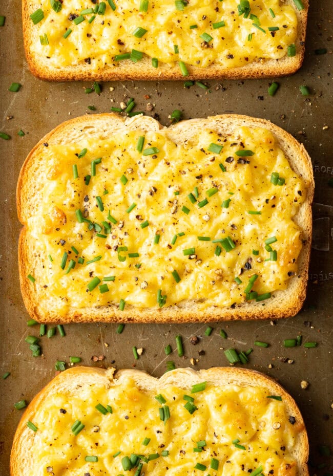 Cheese Toastie - Top down close view toasted bread with cheese and chives.