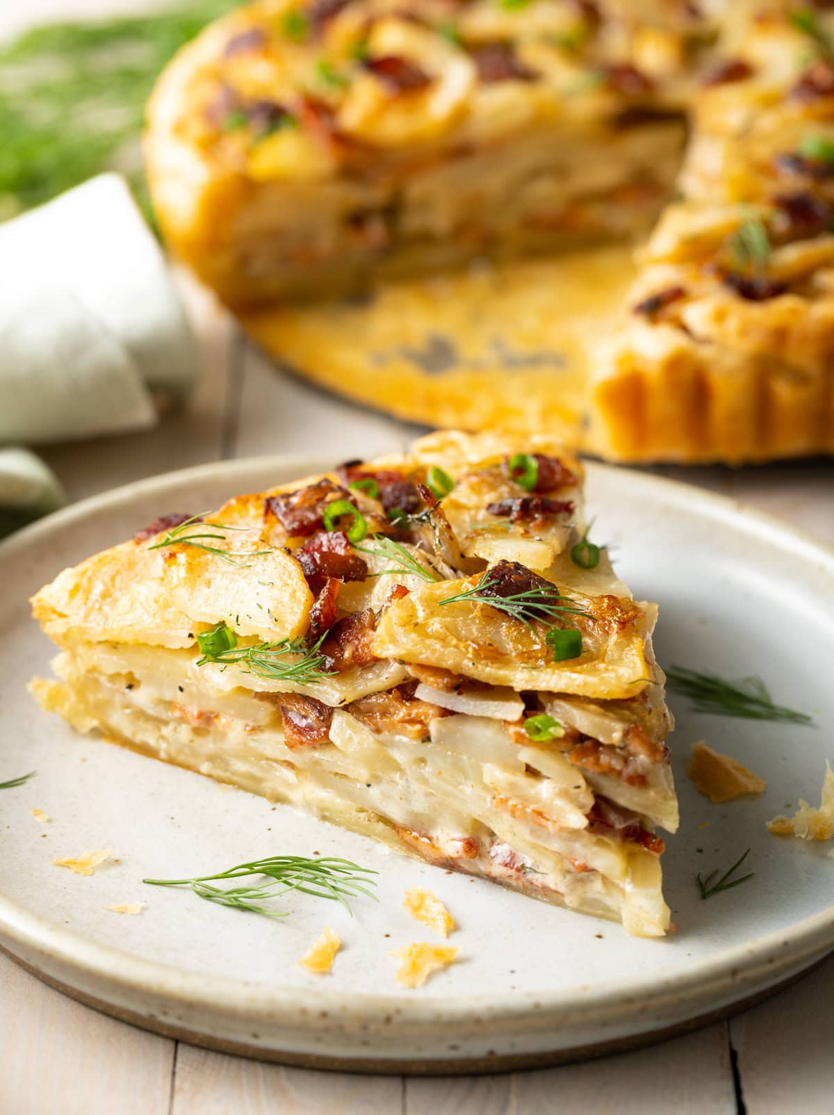 Slice of potato pie on a plate. 