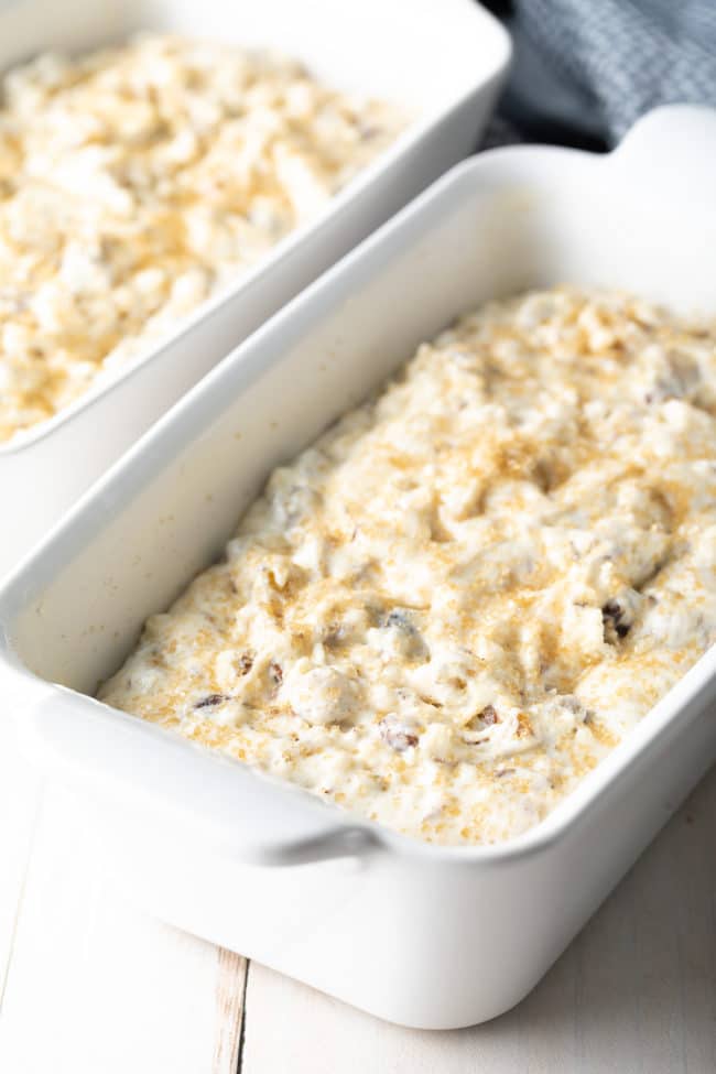 Raisin Irish soda bread batter in a white ceramic baking dish. 