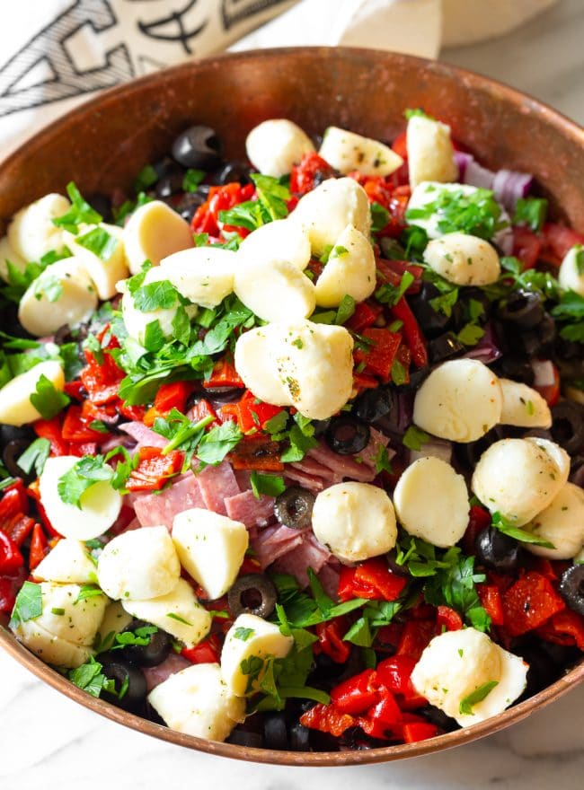 Mozzarella Balls on top of the rest of the ingredients in a large bowl. 