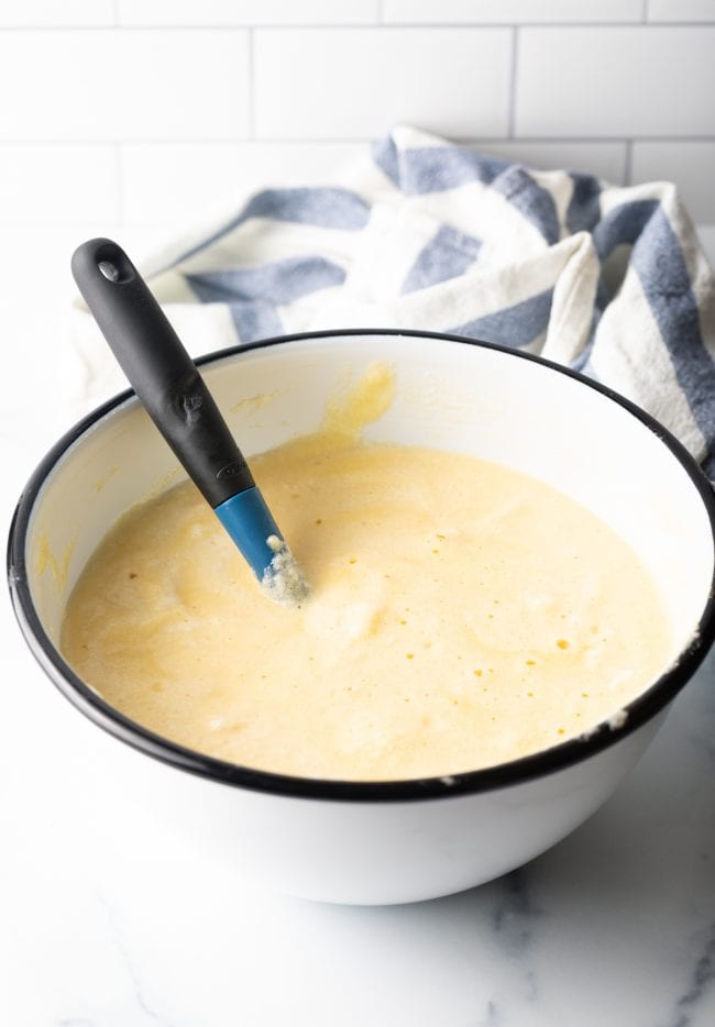 white bowl with cake batter and spatula