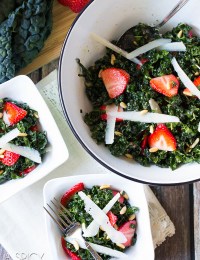 A slightly wilted kale salad recipe kissed with a honey-lemon dressing, and tossed with crunchy pine nut, nutty pecorino cheese, and bright blushing strawberries!