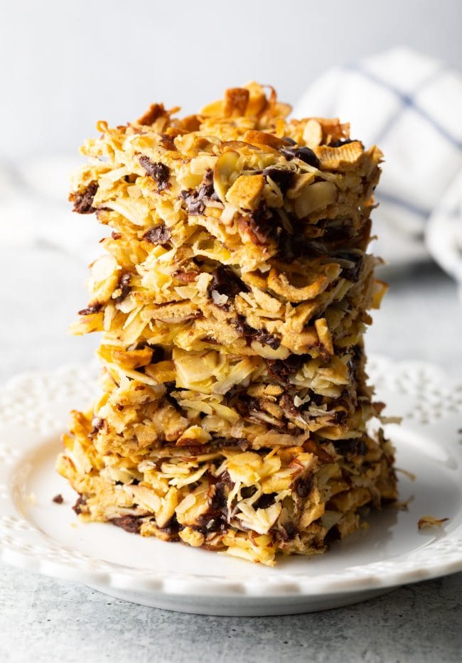 Stack of low carb cereal snack bars on a white plate.