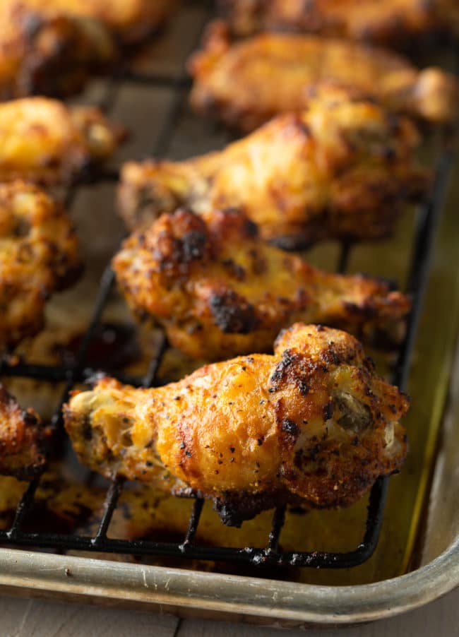 Crispy Lemon Pepper Chicken Wings Recipe #ASpicyPerspective #chicken #wings #lemon #lemonpepper #baked #lowcarb #keto #paleo #whole30 #superbowl