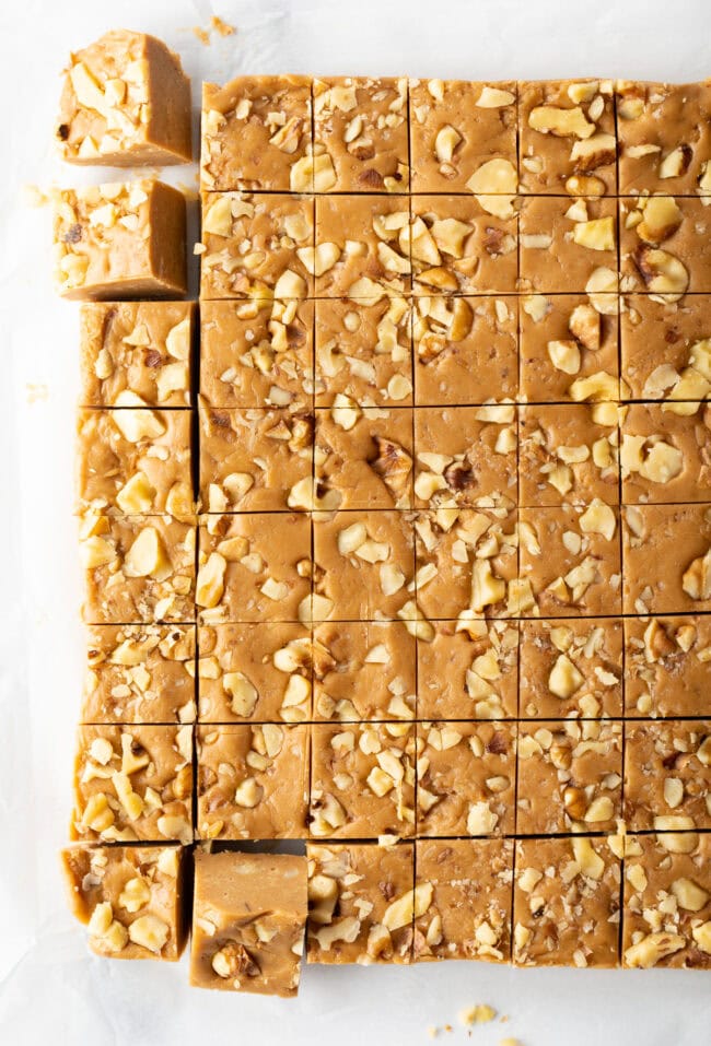 Top down view maple fudge cut into small squares.