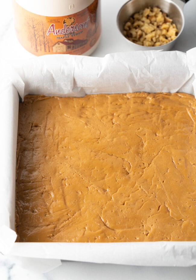 Mixture pressed into a square pan lined with parchment paper.