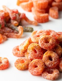 Close view of pile of Mexican chamoy candy gummy rings.