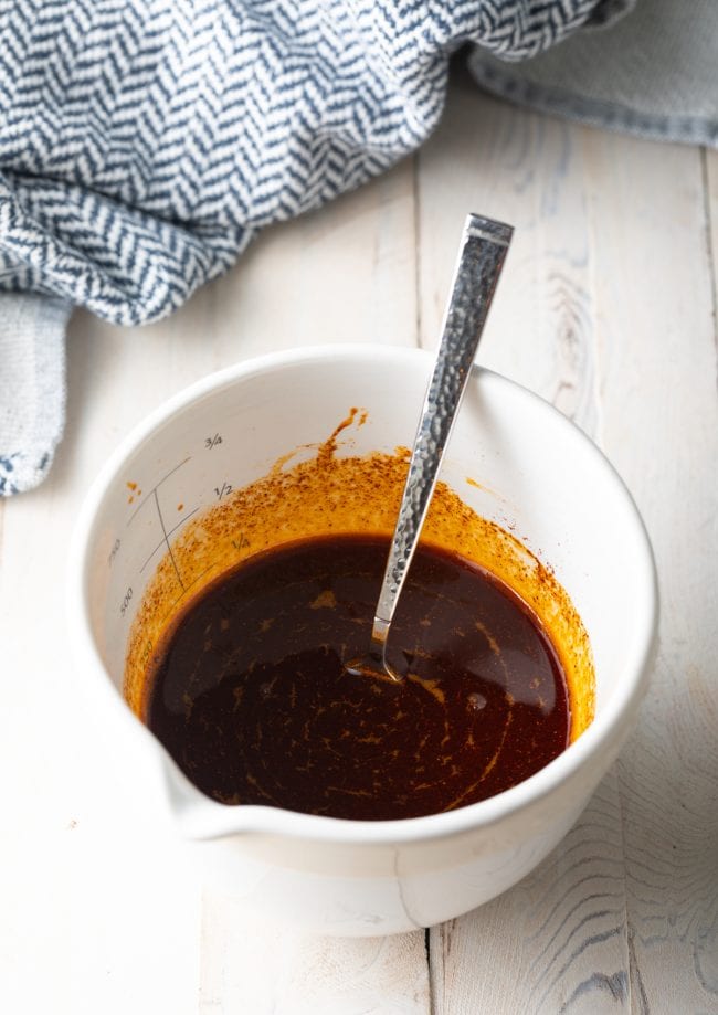 Spicy hot oil in a measuring cup after being mixed. 