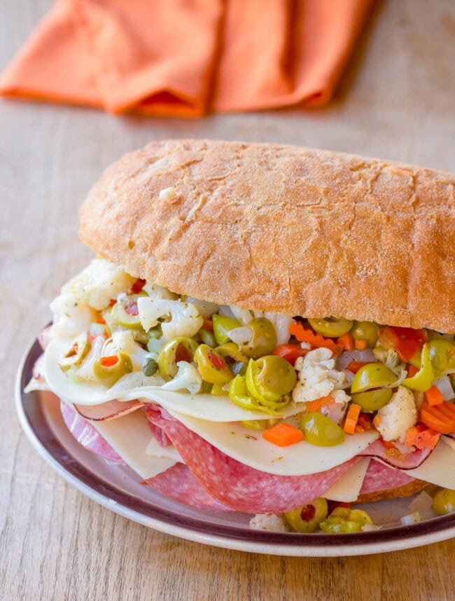 Awesome New Orleans Muffuletta Sandwich served on a plate. 