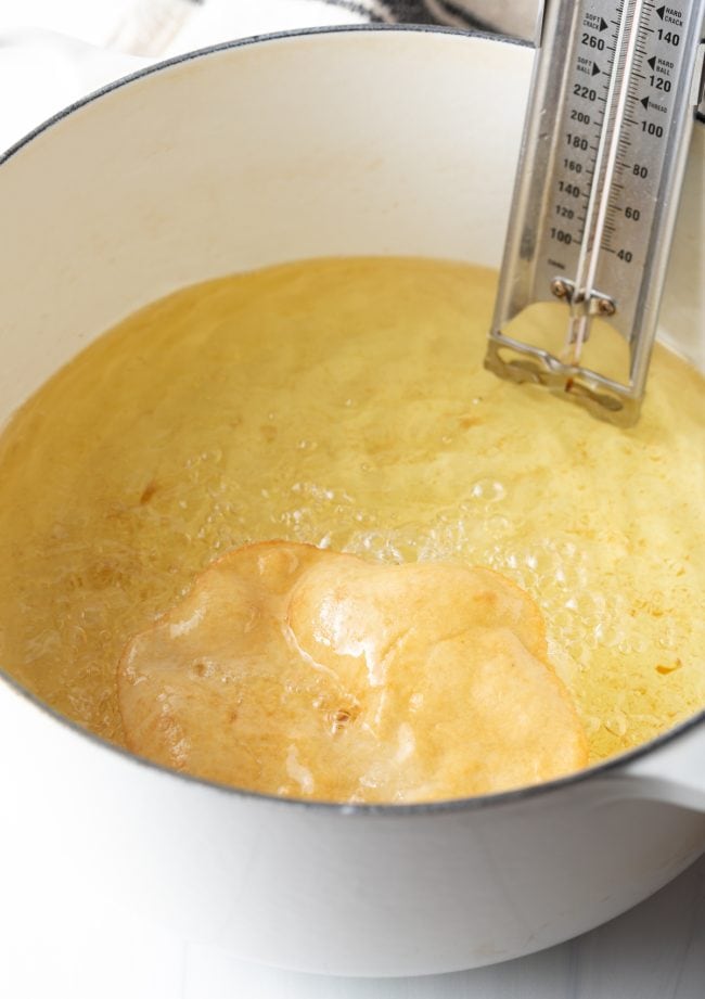 Flipping the fry bread in the oil. 