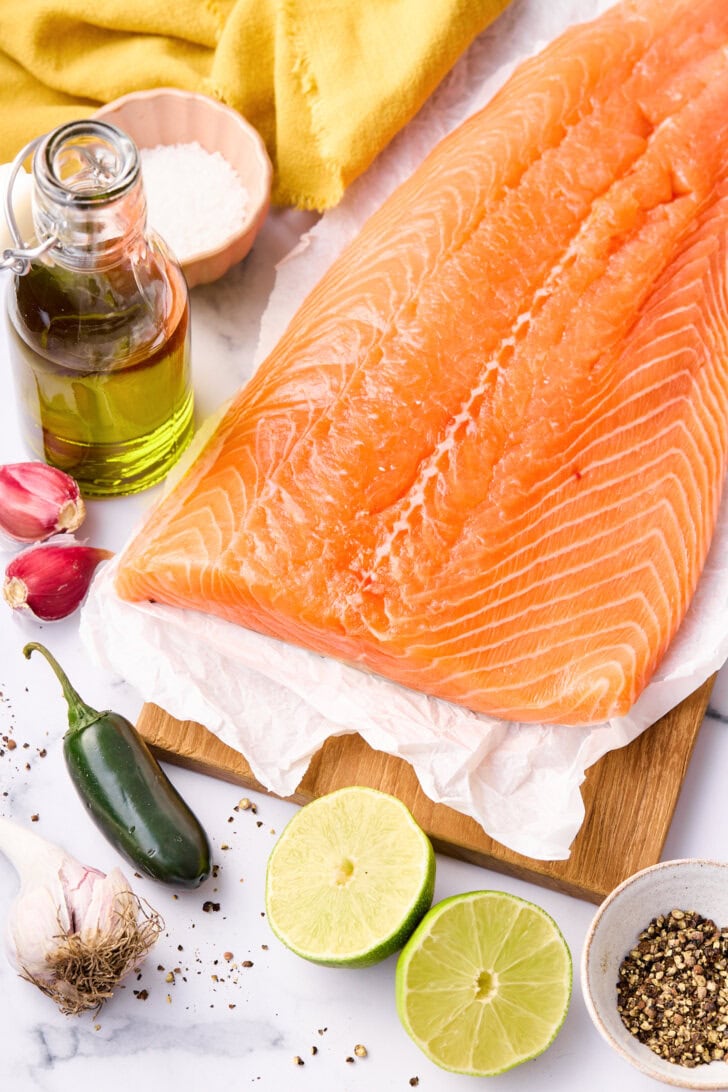 Ingredients for baked salmon on tray.