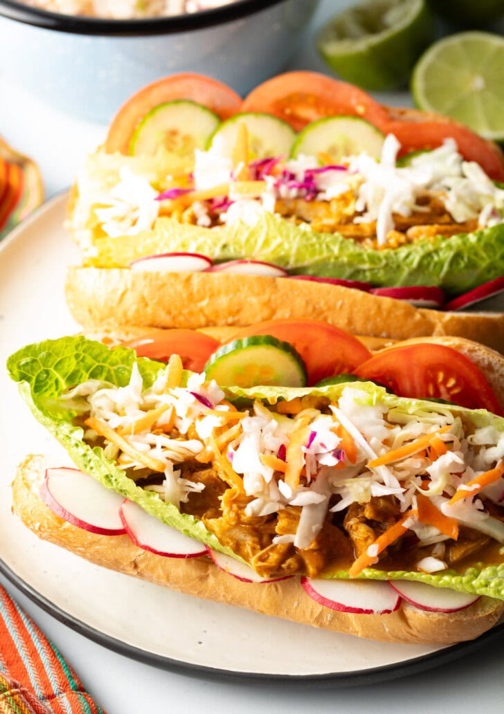 Close view of a pan con pollo loaded with veggies and chicken.