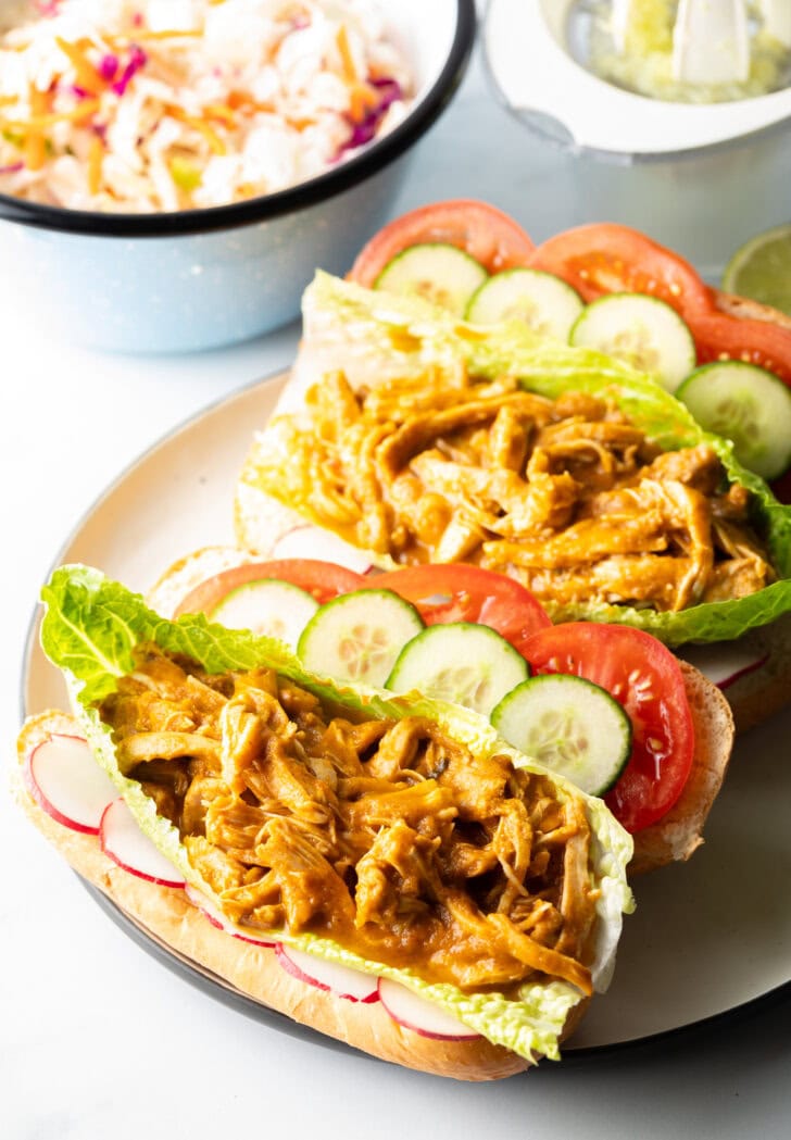 Rolls with veggies, lettuce, and chicken stew.