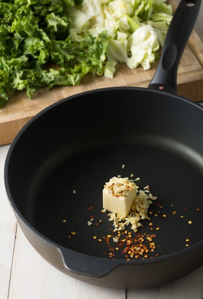 Butter, garlic, ginger, and red pepper in a skillet.