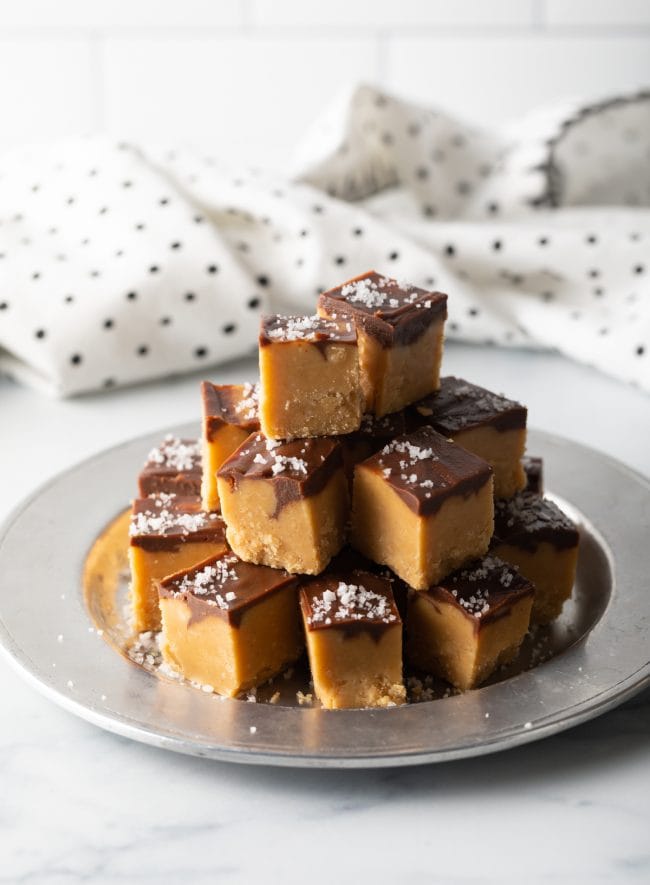 pulled out view of pieces of Peanut Butter Candy stacked on a silver plate