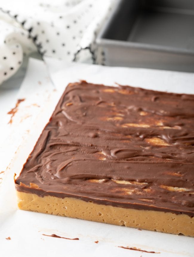 chilled Chocolate Peanut Butter Candy on parchment paper in large square