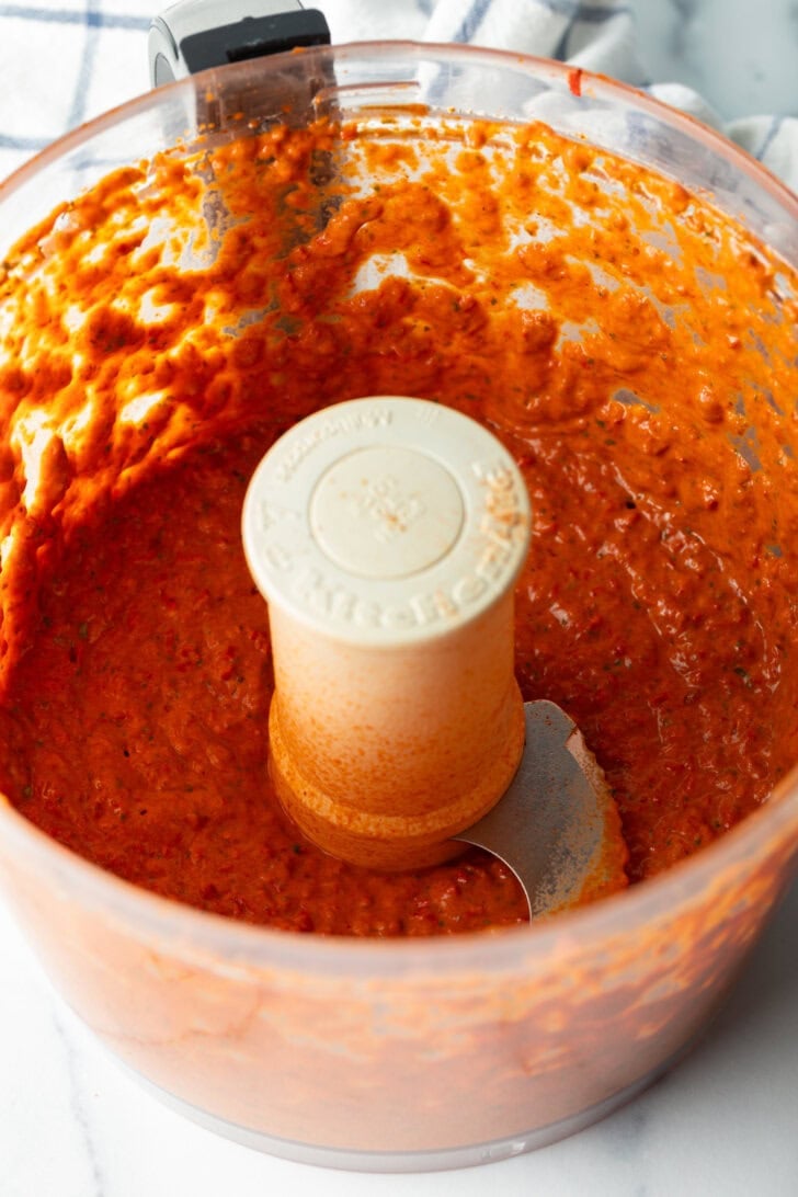 Pureed red pepper sauce in a food processor.