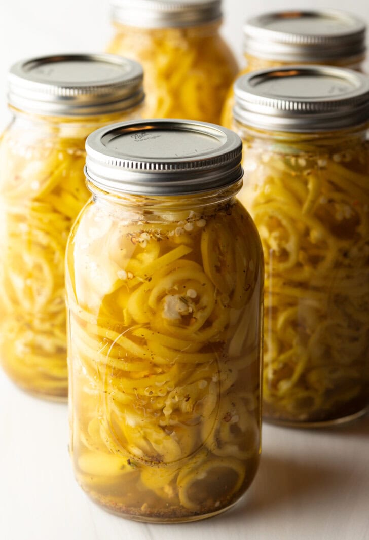 4 large sealed jars of canned pickled banana peppers