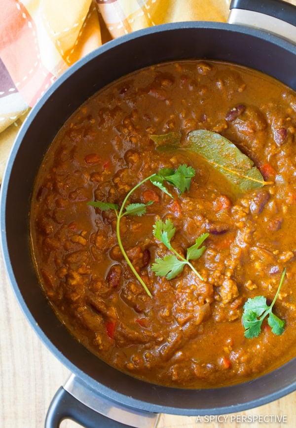 Overhead view of pumpkin chili in a large pot. 