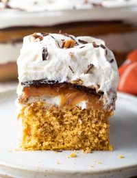 Easy Layered Pumpkin Turtle Cheesecake Recipe #ASpicyPerspective #pumpkin #cheesecake #caramel #chocolate #holiday