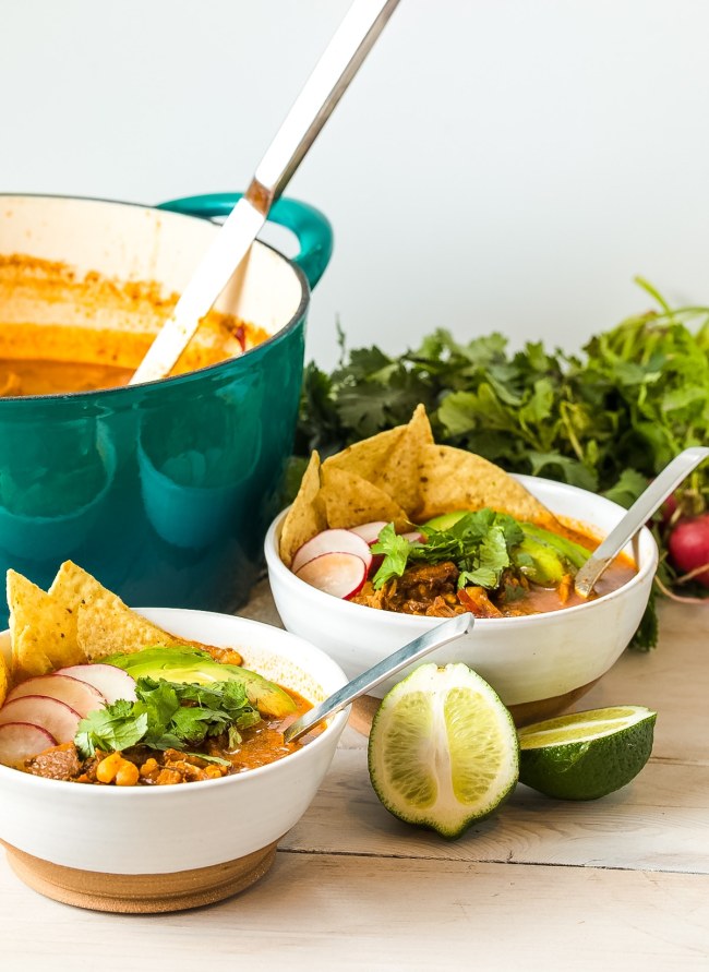 Pozole Rojo bowls served with lime wedges