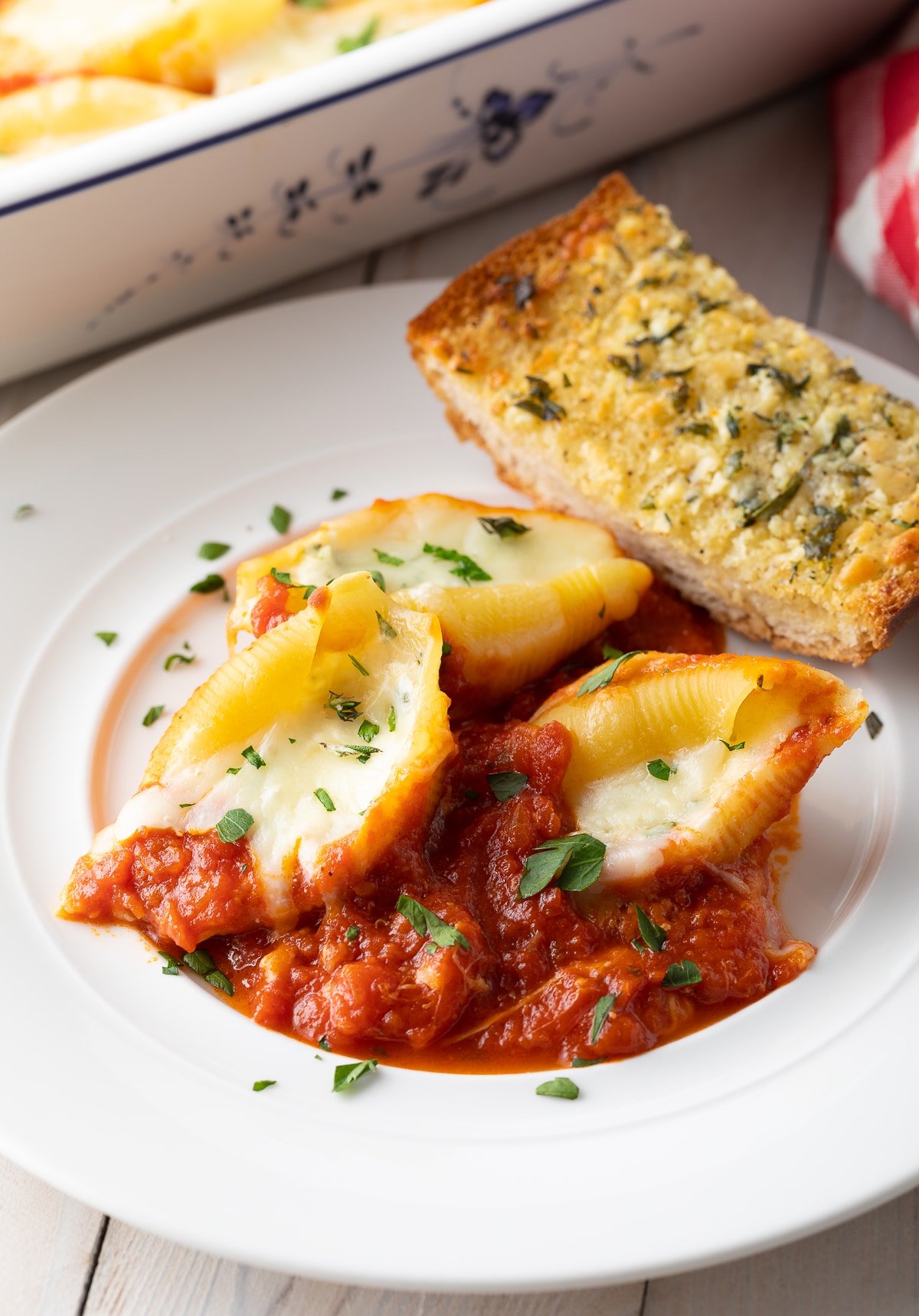 How To Make Ricotta Stuffed Shells on plate with bread