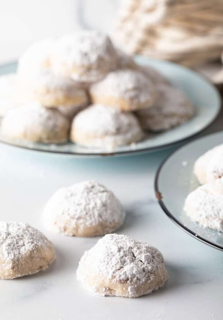 Best Russian Tea Cake Recipe - cookies laying on white counter.