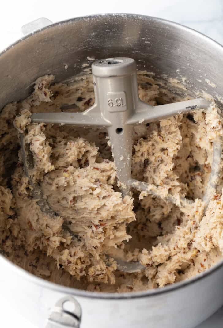 Cookie down in a standing mixer bowl, with paddle attachment in the bowl.