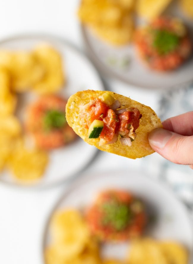 scoop of salmon poke on a potato chip