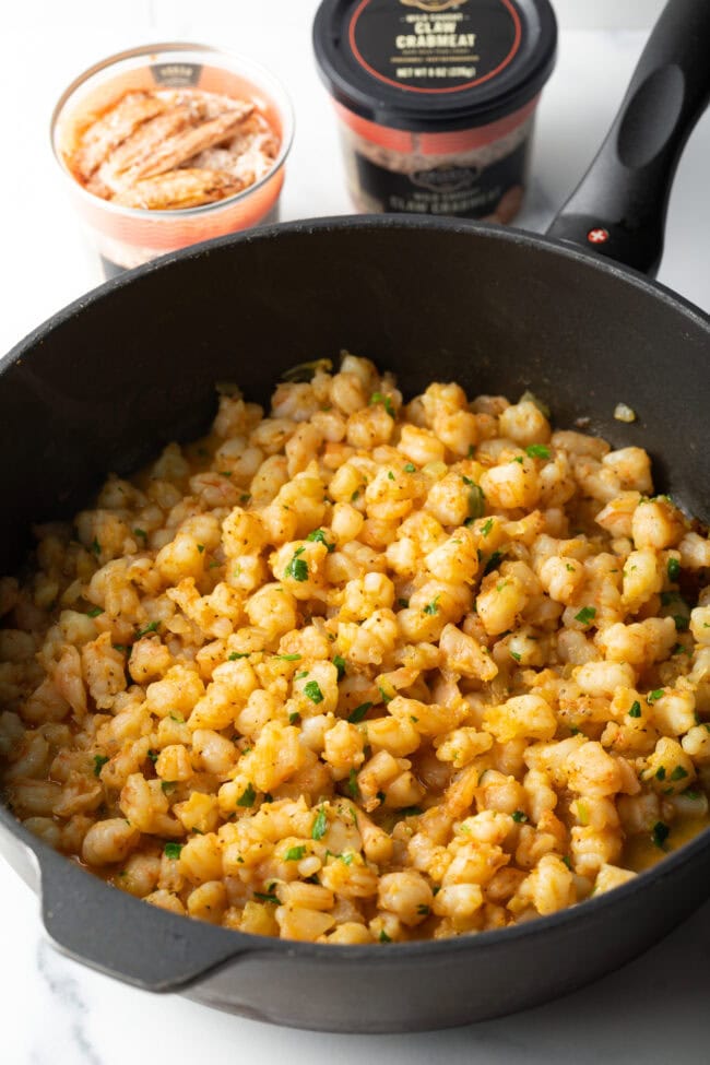 Cooked shrimp and crab in a skillet.