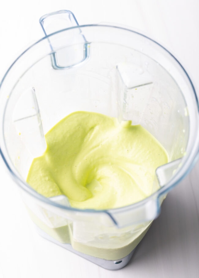 Blended peppermint shamrock shake in a blender jar.