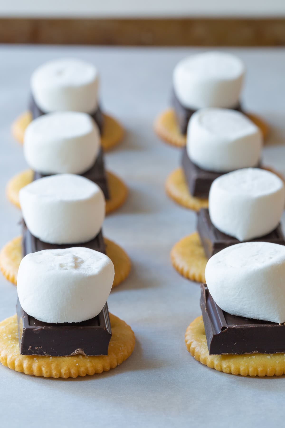 Ritz cracker s'mores with dark chocolate and marshmallows. 