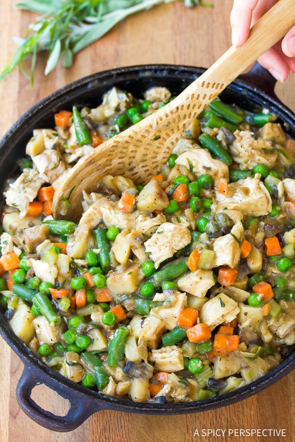 Overhead shot of turkey pot pie filling in a cast iron skillet. 