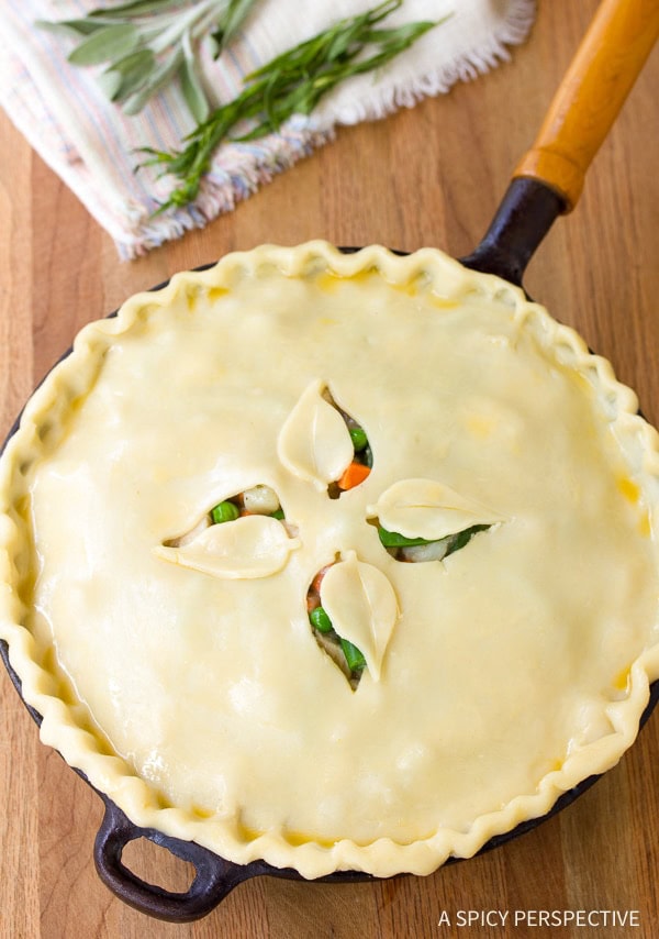 Skillet pot pie with pie crust on top before being baked. 