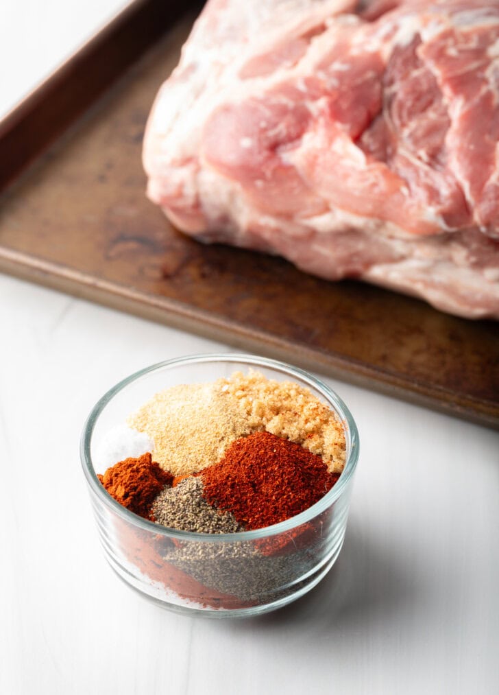 Blend of dry spice rub seasonings in a glass bowl.