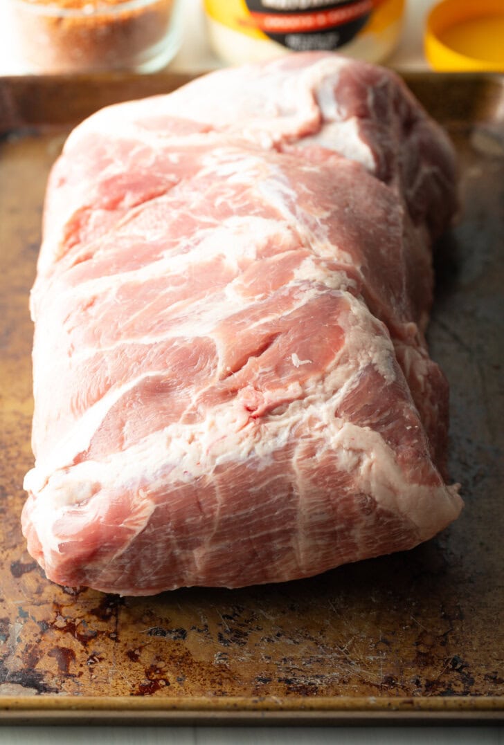 Raw giant slab of pork butt.